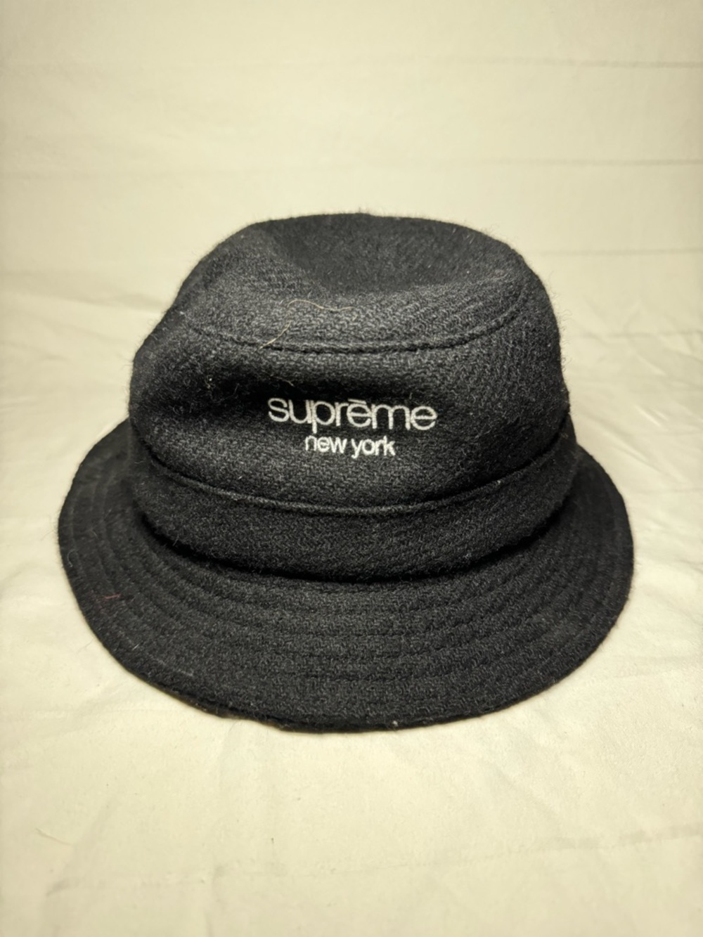 Supreme Black Bucket Hat with Red Logo Tag tweed crusher